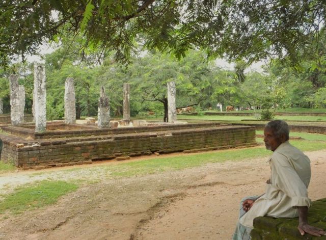 Old man and some ruins in Polonnaruwa